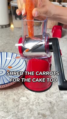 Rotary cheese grater with hand crank